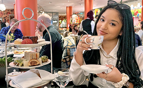 Photo of Caroline Binkley sipping tea